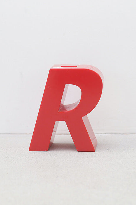 "R" plastic piggy bank